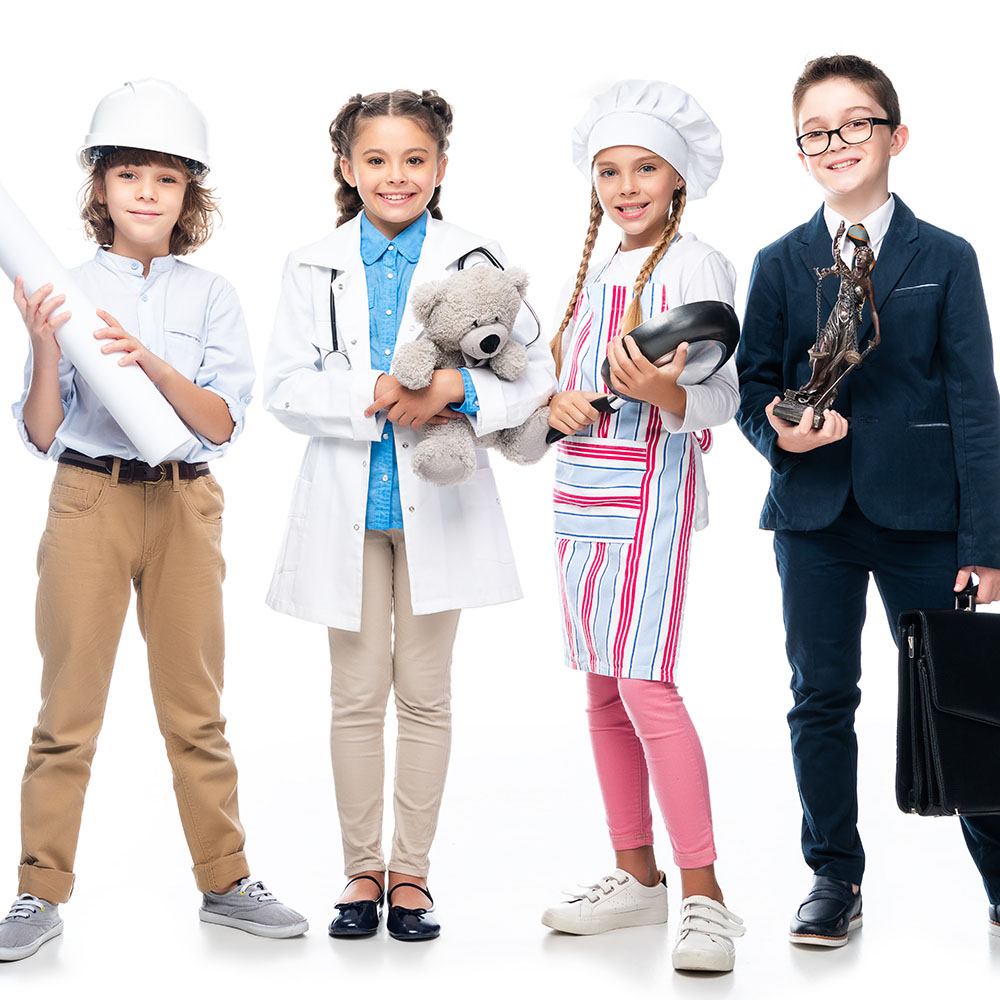 happy schoolchildren in costumes of different professions isolated on white