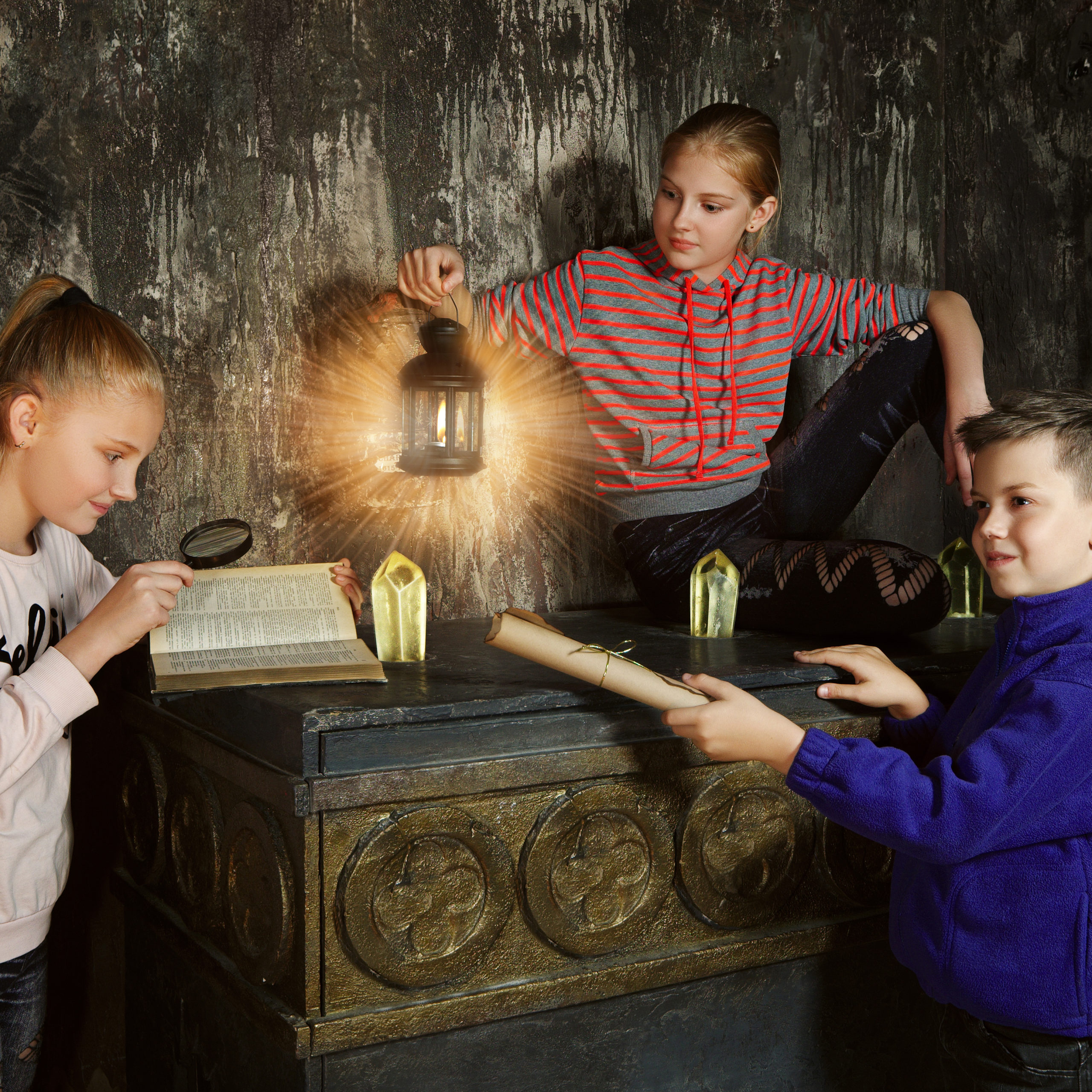 Three children in quest game solving a puzzle